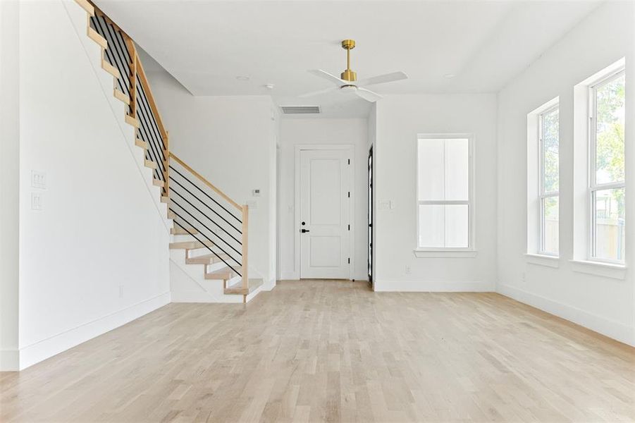 Foyer featuring ceiling fan and light hardwood / wood-style flooring