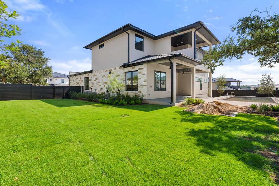 Front exterior of a new home in Milky Way at River Place, Austin, TX, highlighting curb appeal (Image 19).