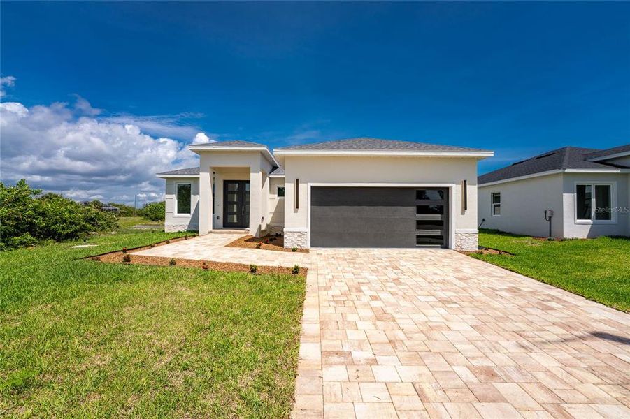Front exterior of a new home in , Rotonda West, FL, highlighting curb appeal (Image 28).
