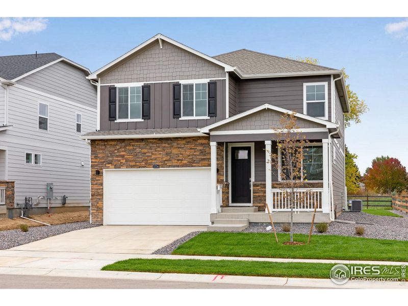 Front exterior of a new home in Hansen Farm, Fort Collins, CO, highlighting curb appeal (Image 2).