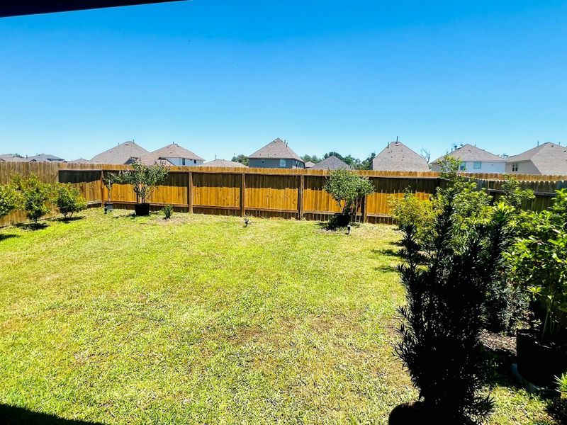 Exterior details and patio area of a home in Bluebonnet Village, Bellville (Image 23).