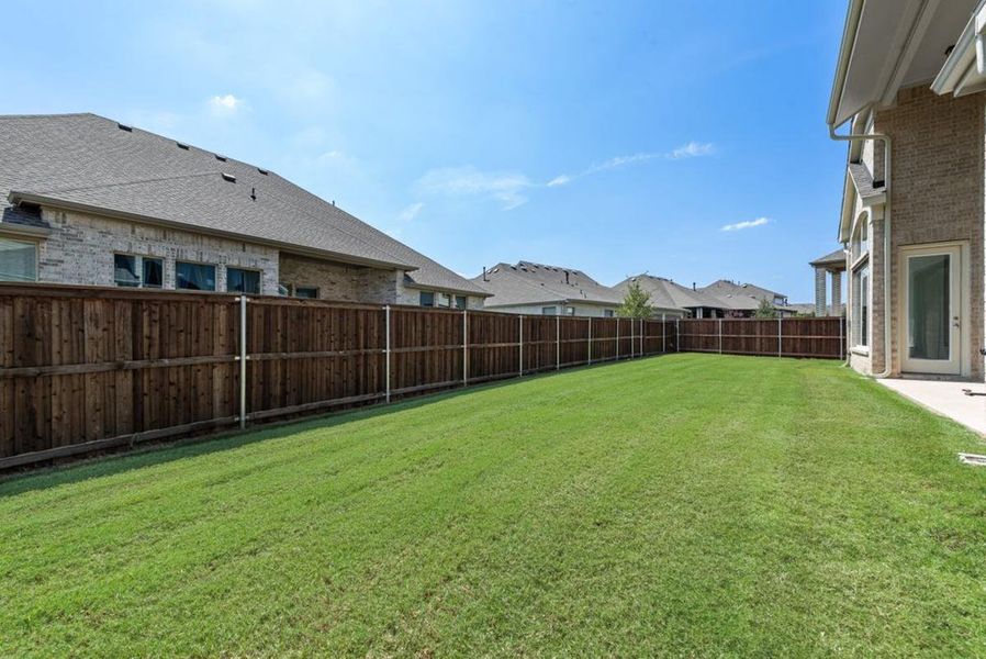 Exterior details and patio area of a home in South Pointe, Mansfield (Image 4). Exterior details and patio area of a home in South Pointe, Mansfield (Image 4).