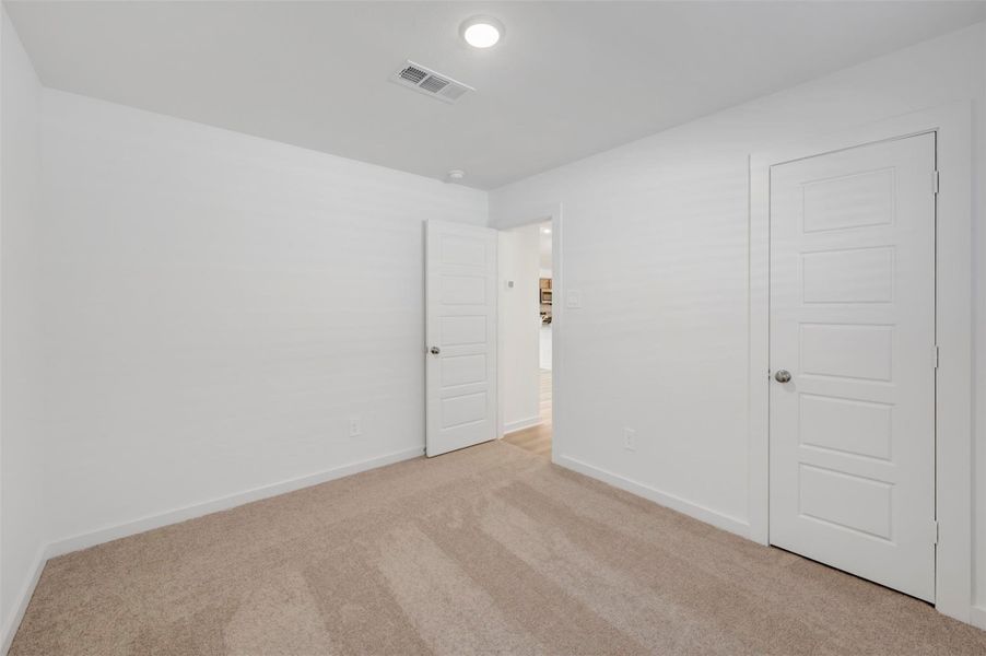 Spacious, unfurnished interior of a new home in Pinewood at Grand Texas, New Caney (Image 25).