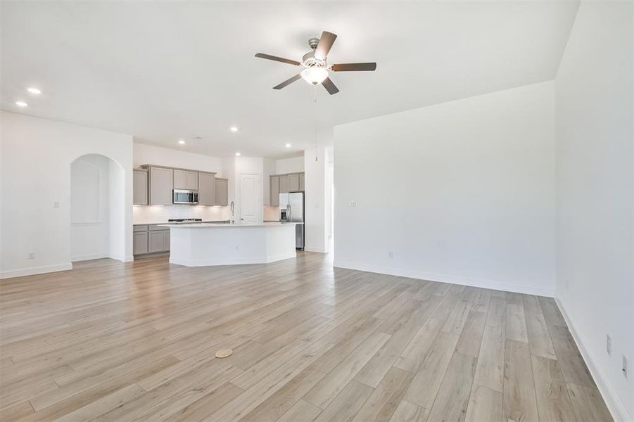 Family Room Seamlessly Open to Kitchen, creating a Perfect Space for Gathering and Entertaining