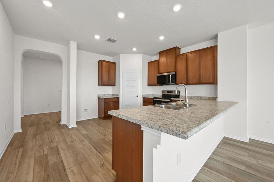 Furnished interior view inside a new home in Stoney Chase, Del Valle (Image 7).