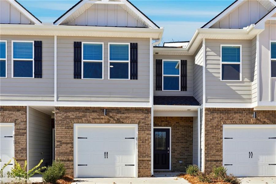 Front exterior of a new home in Carolina, Palmetto, GA, highlighting curb appeal (Image 11). Front exterior of a new home in Carolina, Palmetto, GA, highlighting curb appeal (Image 11).