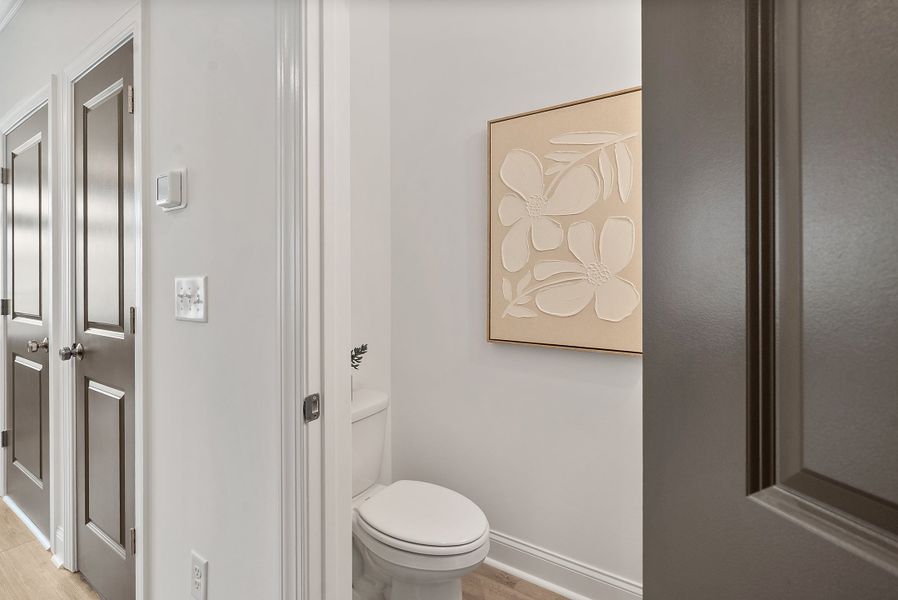 Representative furnished interior of a home built from the The Oleander by The Providence Group in Market Square at Sawnee Village, Cumming (Image 26).