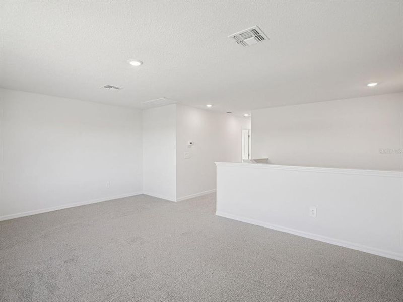 Spacious, unfurnished interior of a new home in The Grove at Stuart Crossing - Classic Series, Bartow (Image 30).