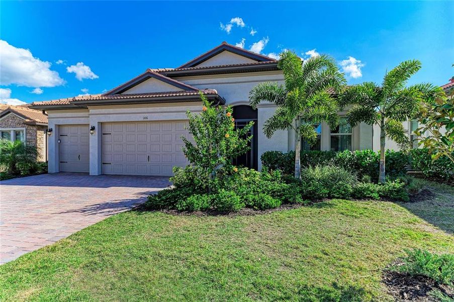 Front exterior of a new home in , Nokomis, FL, highlighting curb appeal (Image 1). Front exterior of a new home in , Nokomis, FL, highlighting curb appeal (Image 1).