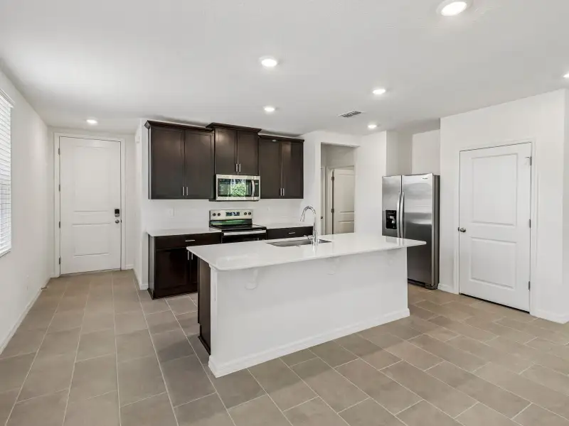 Furnished interior view inside a new home in Bradford Park, Ormond Beach (Image 3).