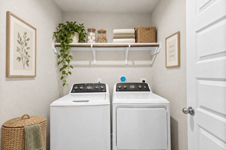 This functional laundry room offers a bright, well organized space designed for everyday convenience. Open shelving above provides ample storage for detergent, linens, and other essentials, while the neutral palette keeps the space feeling fresh and clean. It's a practical spot that makes daily chores just a little bit easier. This functional laundry room offers a bright, well organized space designed for everyday convenience. Open shelving above provides ample storage for detergent, linens, and other essentials, while the neutral palette keeps the space feeling fresh and clean. It's a practical spot that makes daily chores just a little bit easier.