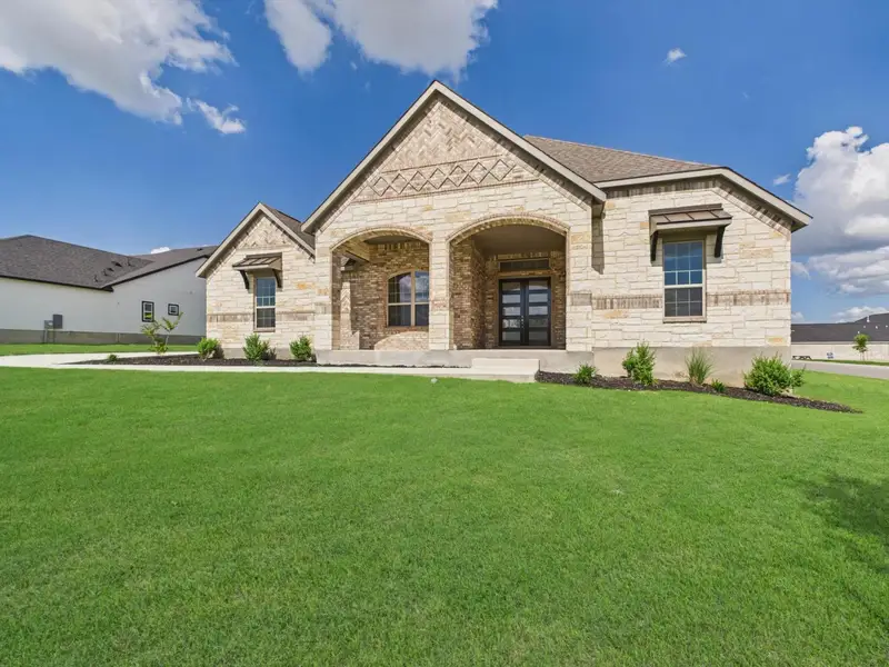 Exterior details and patio area of a home in Potranco Oaks, Castroville (Image 3).