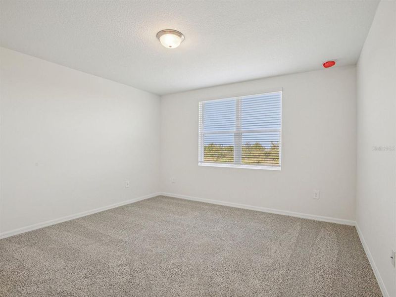 Spacious, unfurnished interior of a new home in The Reserve at Hammock Oaks - Signature Series, Lady Lake (Image 7).