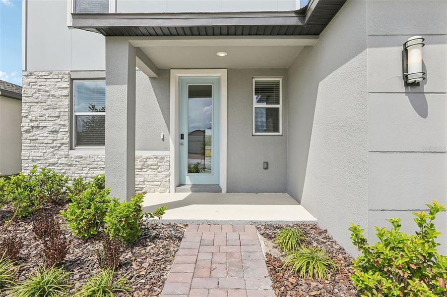Exterior details and patio area of a home in The Meadow at Crossprairie, St. Cloud (Image 3).