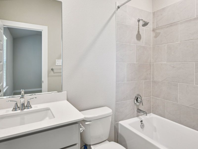 Furnished interior view inside a new home in Riviera Pines - Classic Series, Huffman (Image 6).