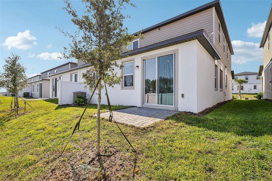 Exterior details and patio area of a home in Cyrene at Minneola - Villas, Minneola (Image 3).