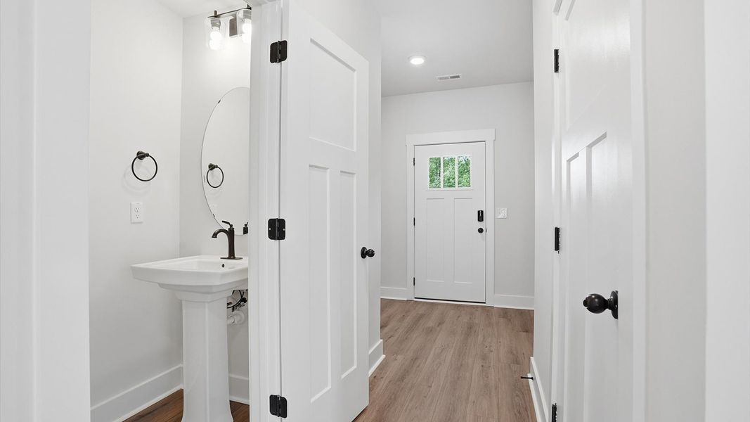 Highly functional foyer with hardwood flooring that flows seamlessly into living spaces at Marion Square Highly functional foyer with hardwood flooring that flows seamlessly into living spaces at Marion Square
