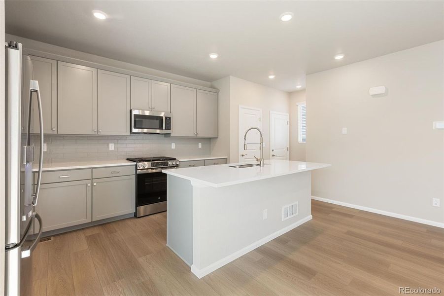 Furnished interior view inside a new home in Woodrose at Painted Prairie, Aurora (Image 14).