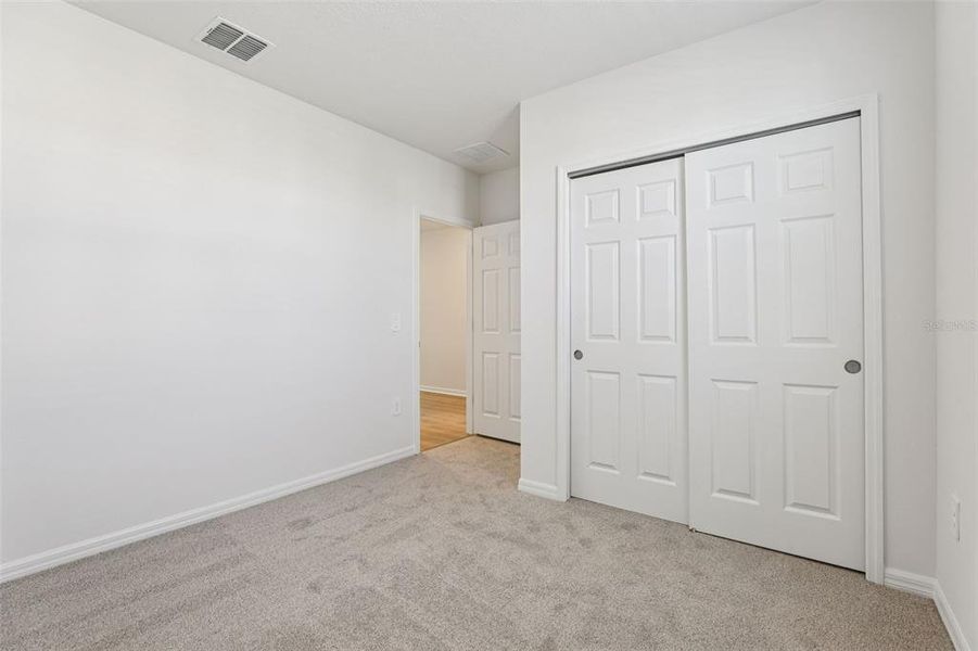 Spacious, unfurnished interior of a new home in Lake Deer Estates - Signature Series, Poinciana (Image 24).