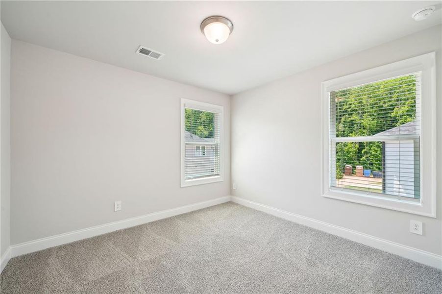 Spacious, unfurnished interior of a new home in Hemingway - Cottage Series, Cumming (Image 32). Spacious, unfurnished interior of a new home in Hemingway - Cottage Series, Cumming (Image 32).