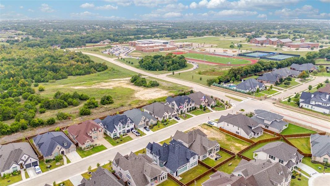 Aerial perspective of suburban area with a tree filled landscape