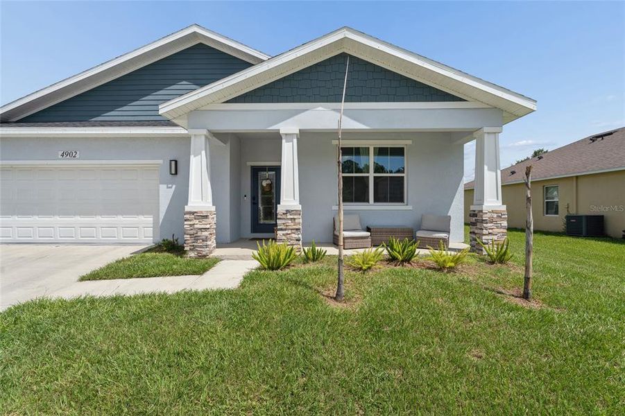 Front exterior of a new home in , Kissimmee, FL, highlighting curb appeal (Image 27). Front exterior of a new home in , Kissimmee, FL, highlighting curb appeal (Image 27).