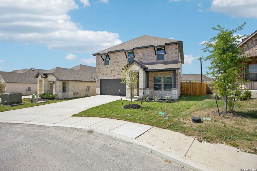 Front exterior of a new home in Arcadia Ridge - Premier Series, San Antonio, TX, highlighting curb appeal (Image 26).