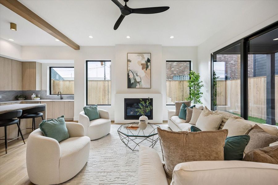 Living room – features a gas fireplace and ample windows that fill the space with natural light. Living room – features a gas fireplace and ample windows that fill the space with natural light.