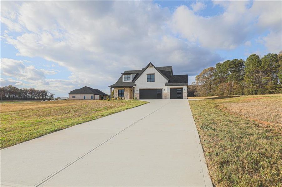 Front exterior of a new home in , Maysville, GA, highlighting curb appeal (Image 22). Front exterior of a new home in , Maysville, GA, highlighting curb appeal (Image 22).