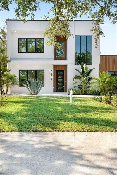 Front exterior of a new home in , Sarasota, FL, highlighting curb appeal (Image 29).