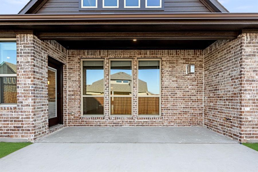 Exterior details and patio area of a home in Stone River Glen 60s, Royse City (Image 21).