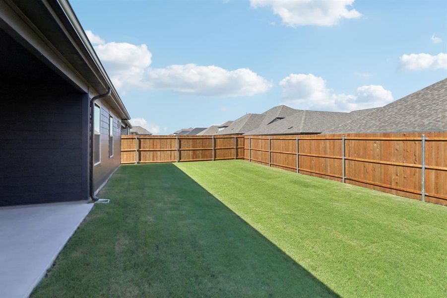 Exterior details and patio area of a home in Southridge - Signature Series, McKinney (Image 21). Exterior details and patio area of a home in Southridge - Signature Series, McKinney (Image 21).