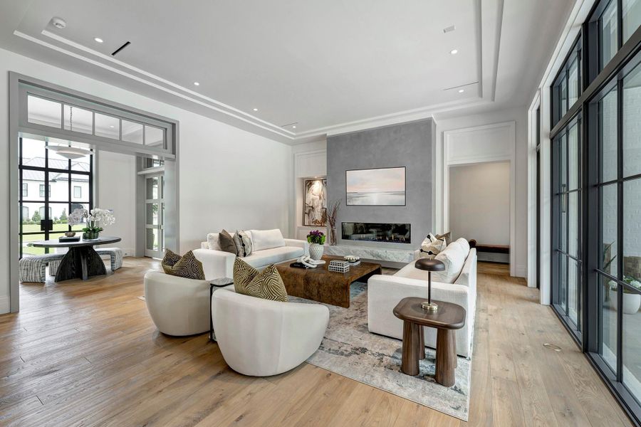 Wall of windows and two doors on your right open to the covered patio providing great flow for entertaining large groups.