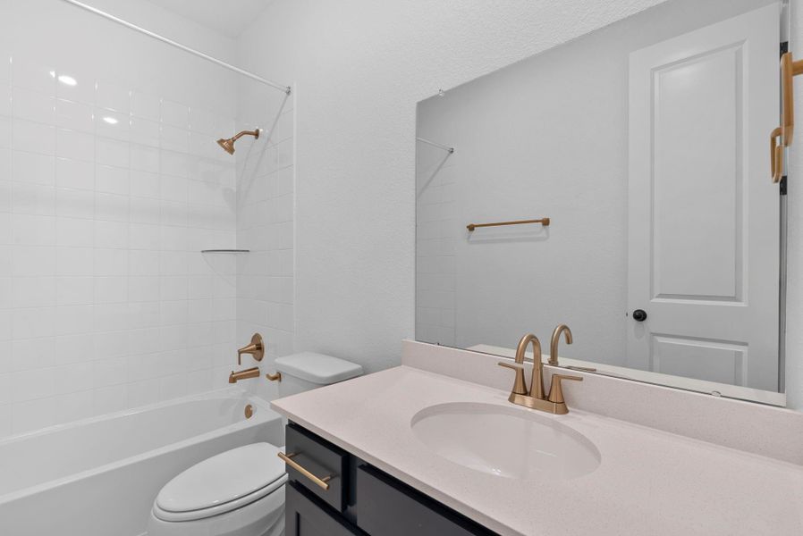 Another secondary bathroom, perfect for guests and family alike.