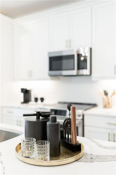 42' inch cabinetry with Quartz counters in each home. Not actual home. Photos of Model Home.