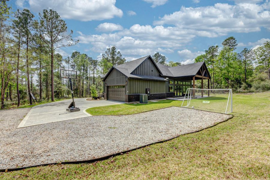 Front exterior of a new home in , Willis, TX, highlighting curb appeal (Image 23).