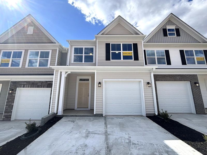 Front exterior of a new home in CraigStone, Woodruff, SC, highlighting curb appeal (Image 1). Front exterior of a new home in CraigStone, Woodruff, SC, highlighting curb appeal (Image 1).