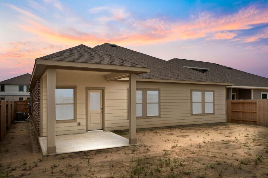 Front exterior of a new home in River Ranch Trails, Dayton, TX, highlighting curb appeal (Image 1).