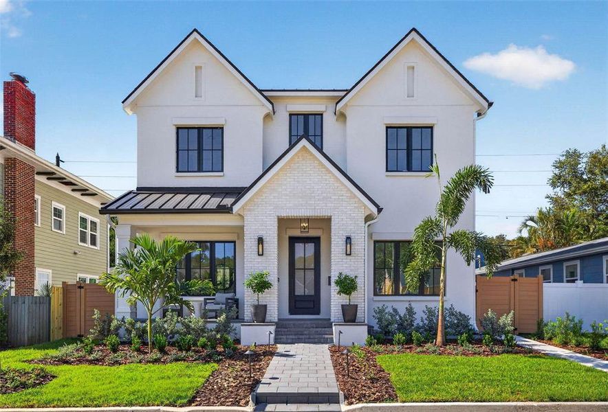Front exterior of a new home in , St. Petersburg, FL, highlighting curb appeal (Image 28). Front exterior of a new home in , St. Petersburg, FL, highlighting curb appeal (Image 28).