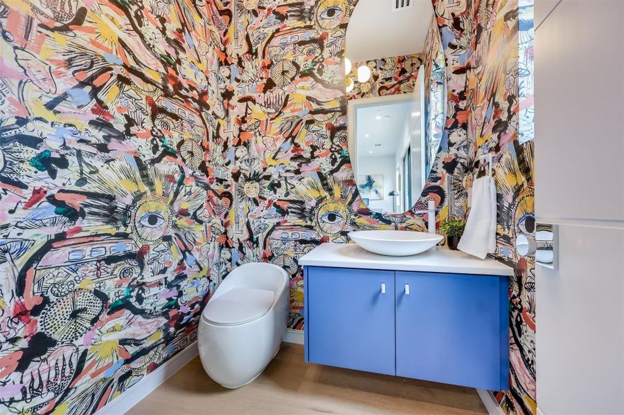 Enjoy some fun here—the "Summer of 69" wallpaper by Mind the Gap brings a hit of nostalgia and hip Austin personality to the main floor