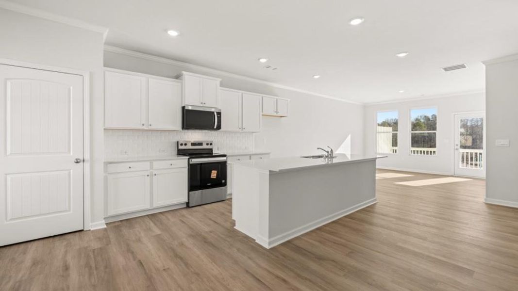 Furnished interior view inside a new home in Waypoint, Flowery Branch (Image 6).