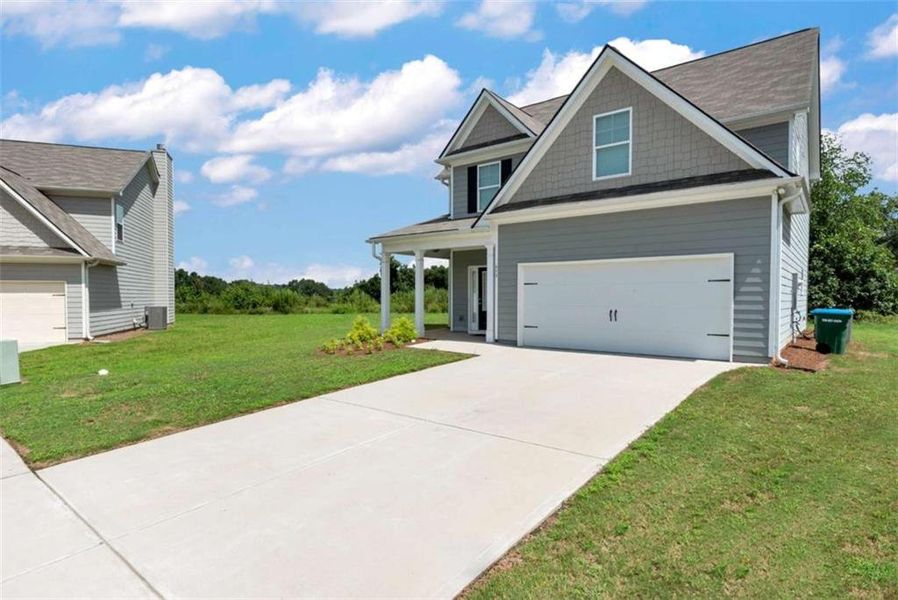 Front exterior of a new home in , Commerce, GA, highlighting curb appeal (Image 23).