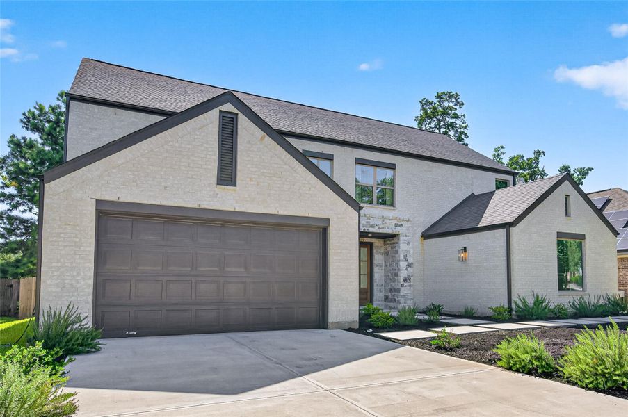 Front exterior of a new home in , Conroe, TX, highlighting curb appeal (Image 22).