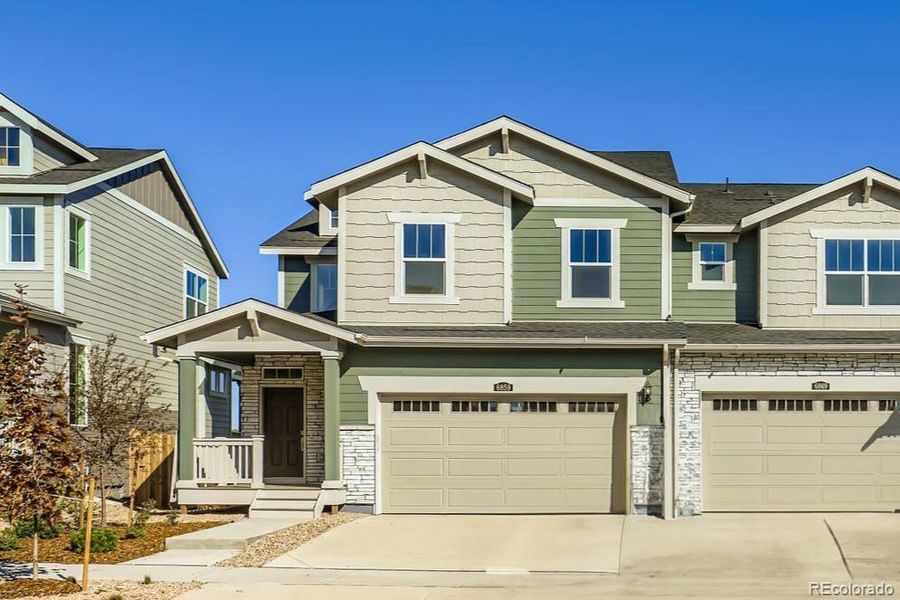 Front exterior of a new home in , Thornton, CO, highlighting curb appeal (Image 1).