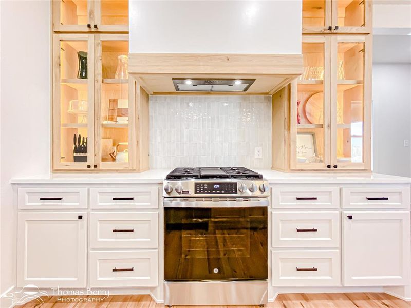 Glass faced cabinets add a unique touch to this home!