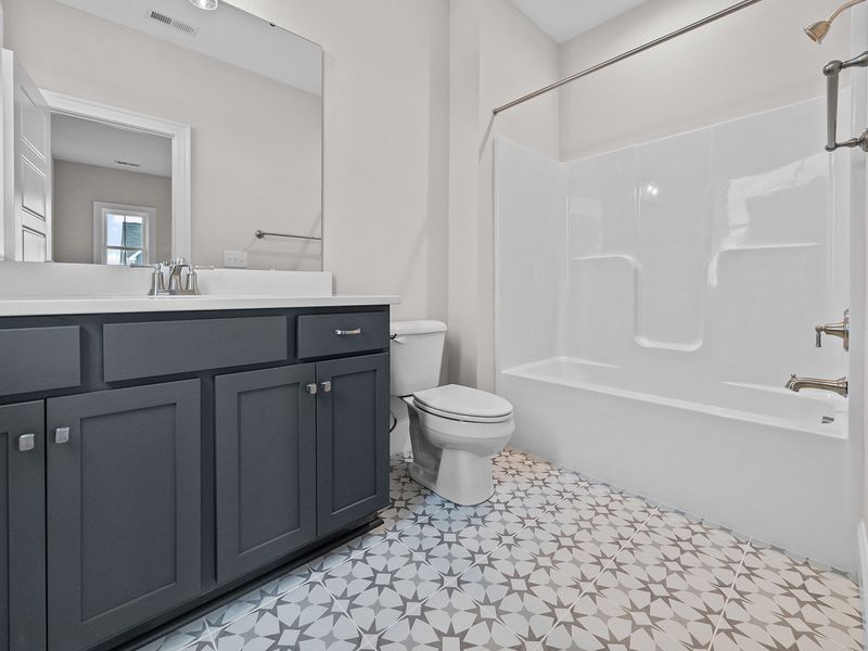 Representative furnished interior of a home built from the The Highland by RobuckHomes in Windwater, Hampstead (Image 9).