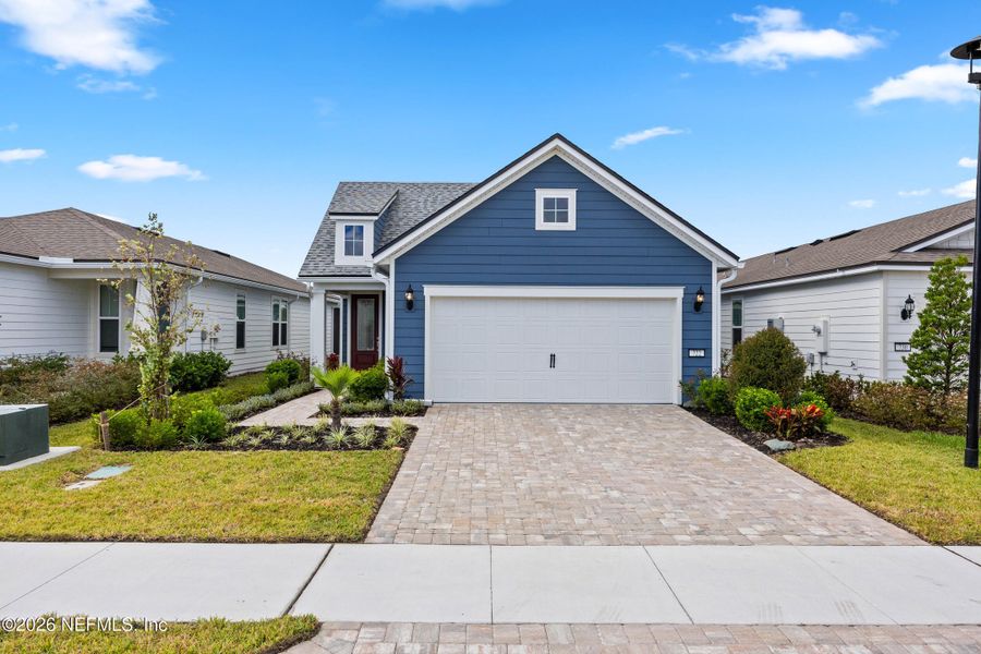 Front exterior of a new home in , Yulee, FL, highlighting curb appeal (Image 25). Front exterior of a new home in , Yulee, FL, highlighting curb appeal (Image 25).