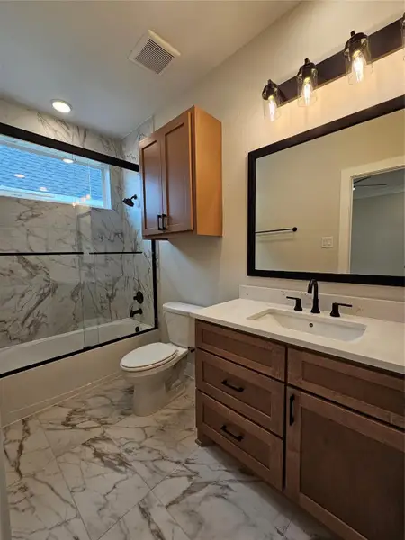 All upstairs bathrooms are elegantly designed with built-in medicine cabinets and convenient storage above the toilet.