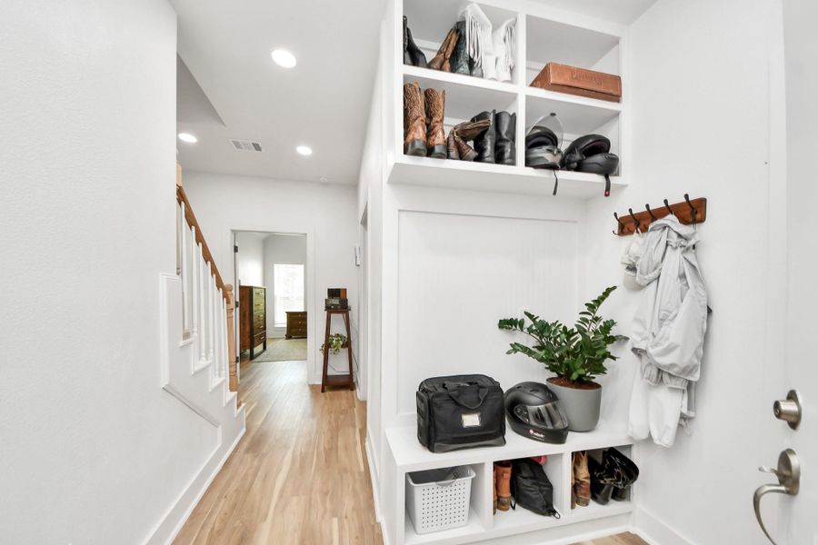 Located just off the garage you will find a dedicated open mudroom. Located just off the garage you will find a dedicated open mudroom.