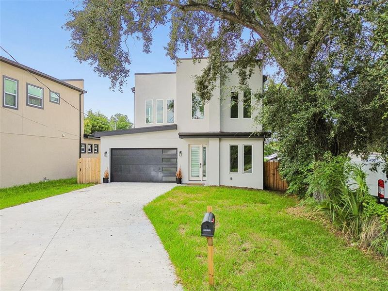Front exterior of a new home in , Tampa, FL, highlighting curb appeal (Image 33).